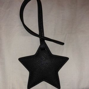 Michael Kors black star bag attachment